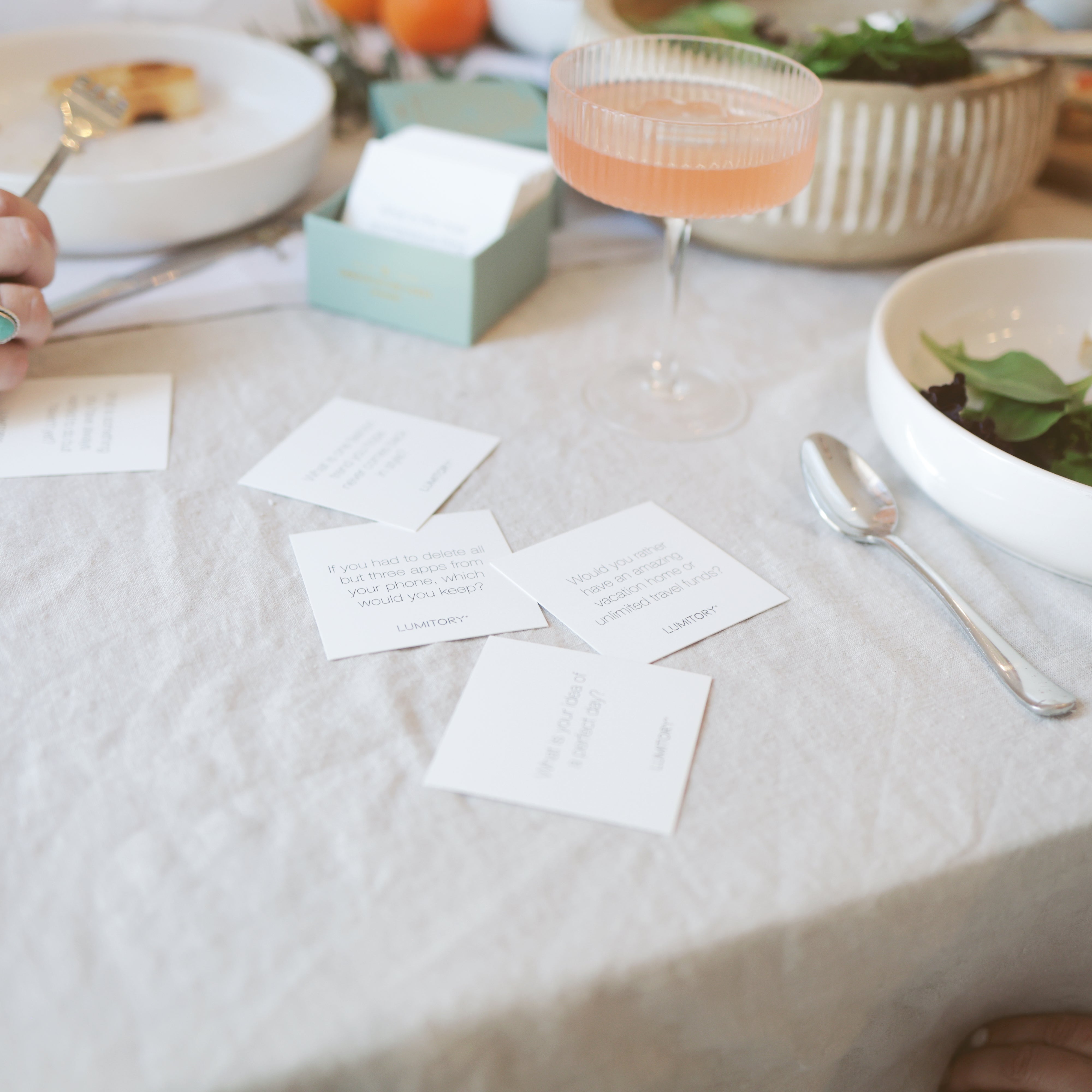 Conversation cards laid out on the dinner table.