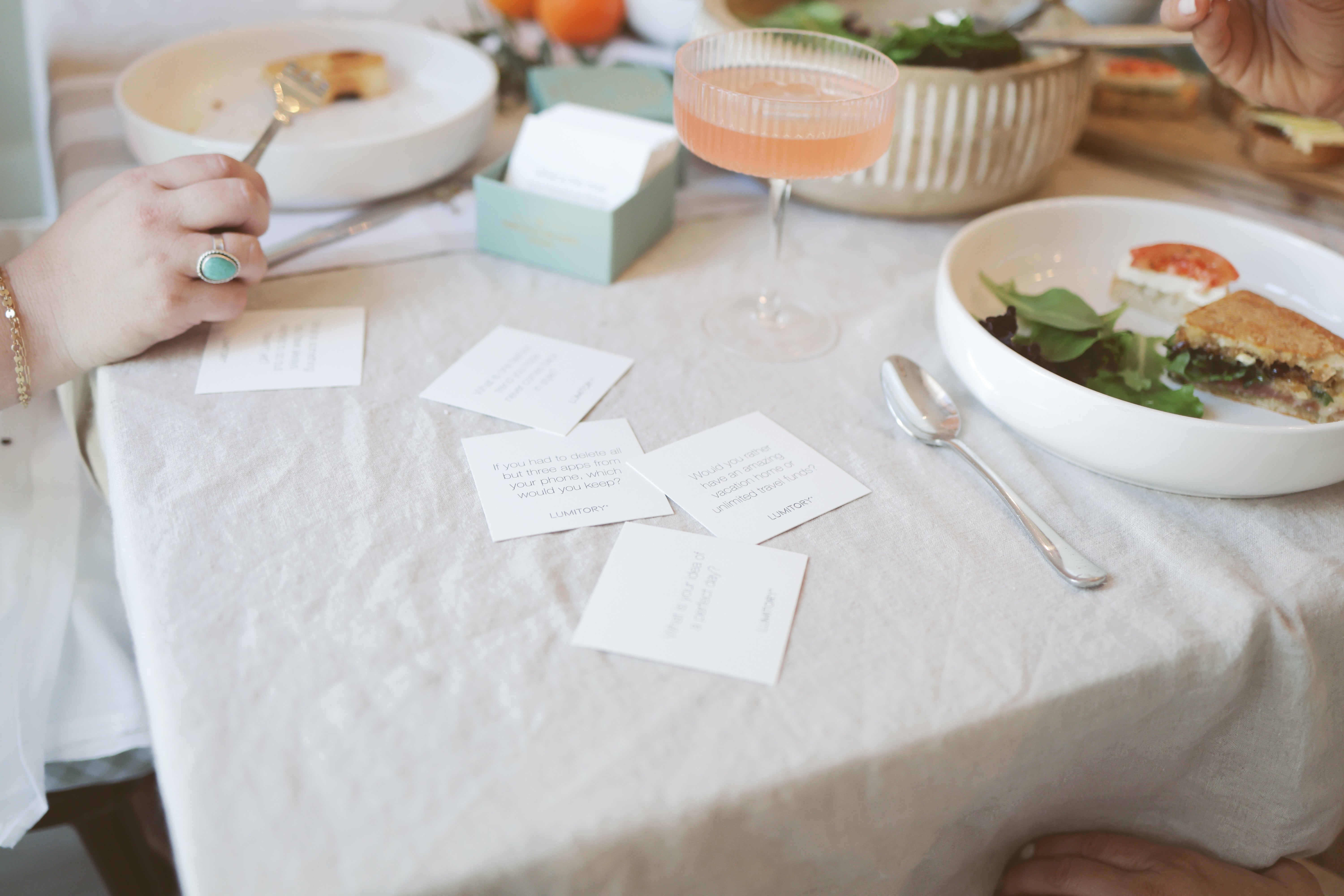 Conversation cards laid out on the dinner table.