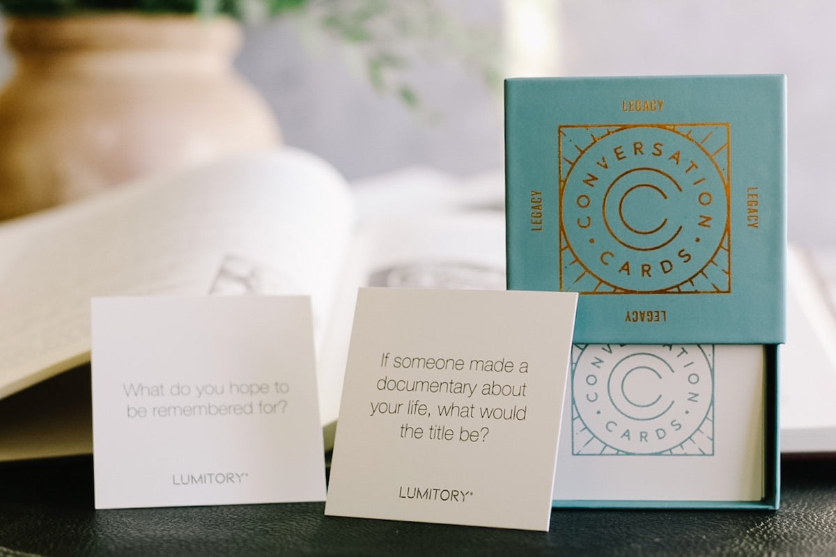 Lumitory - legacy conversation cards staged with family history books